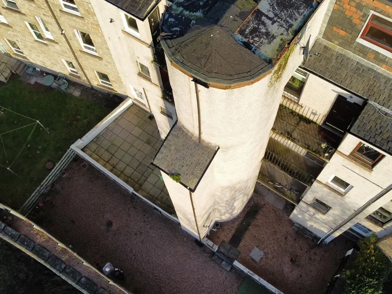 Aerial drone view of Dundee tenement rooftops during a roof survey