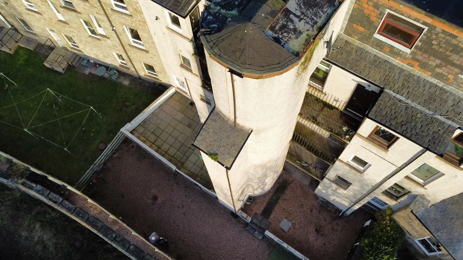 Aerial drone view of Dundee tenement rooftops during a roof survey