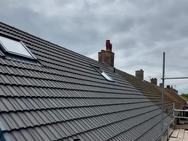 A newly tiled pitched roof with new rooflights, completed in Dundee