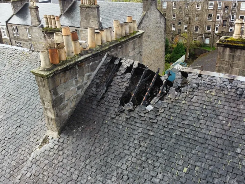 A collapsed section of a Dundee slate roof being repaired