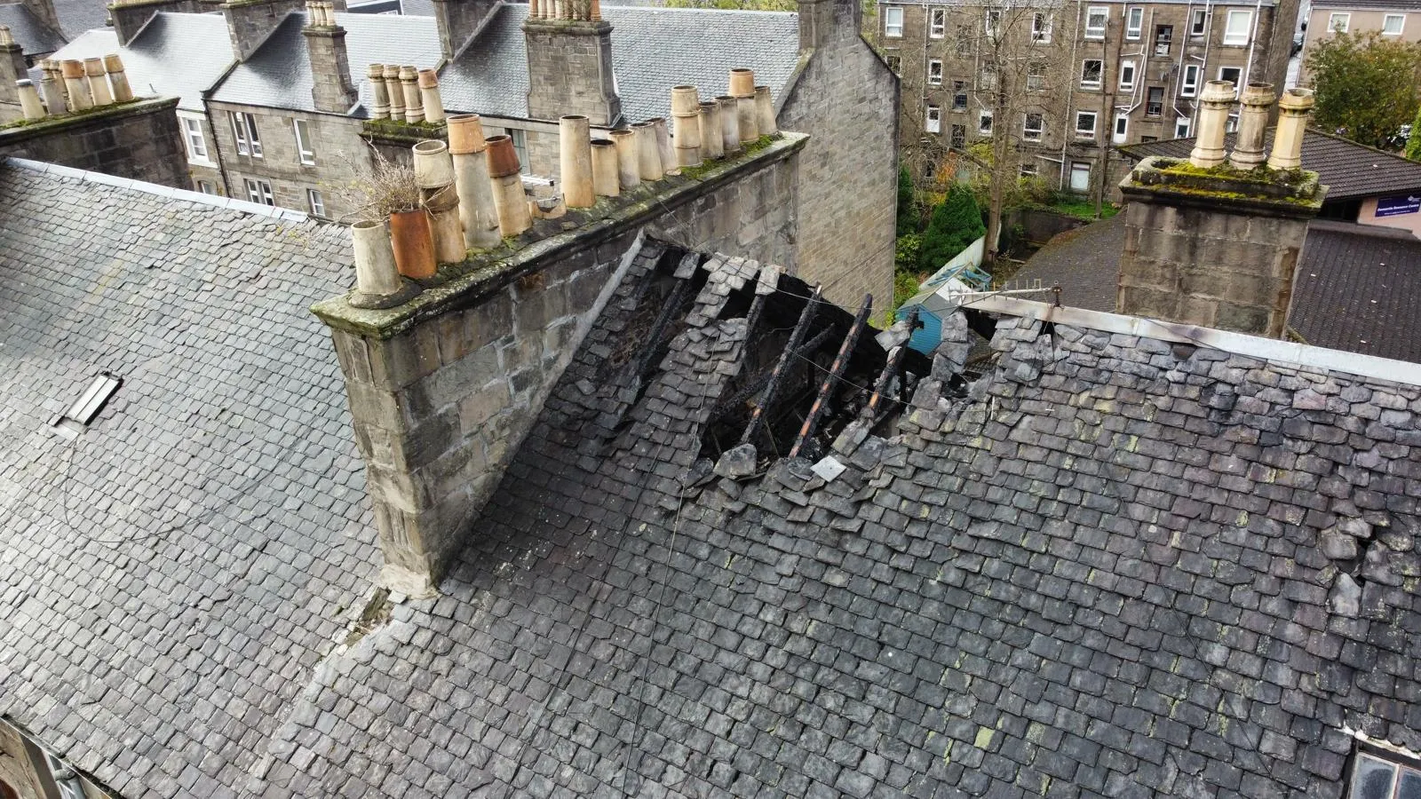 A collapsed section of a Dundee slate roof being repaired
