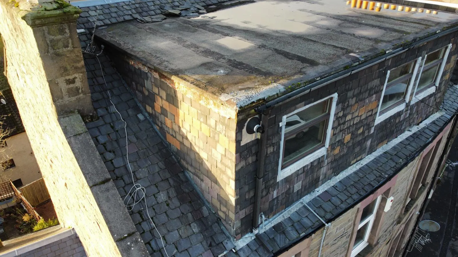 Drone survey view of a slate roof and flat roof on a Dundee property