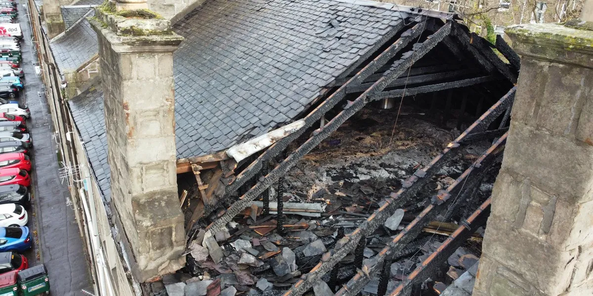 Severe roof damage to a Dundee building, seen from a drone