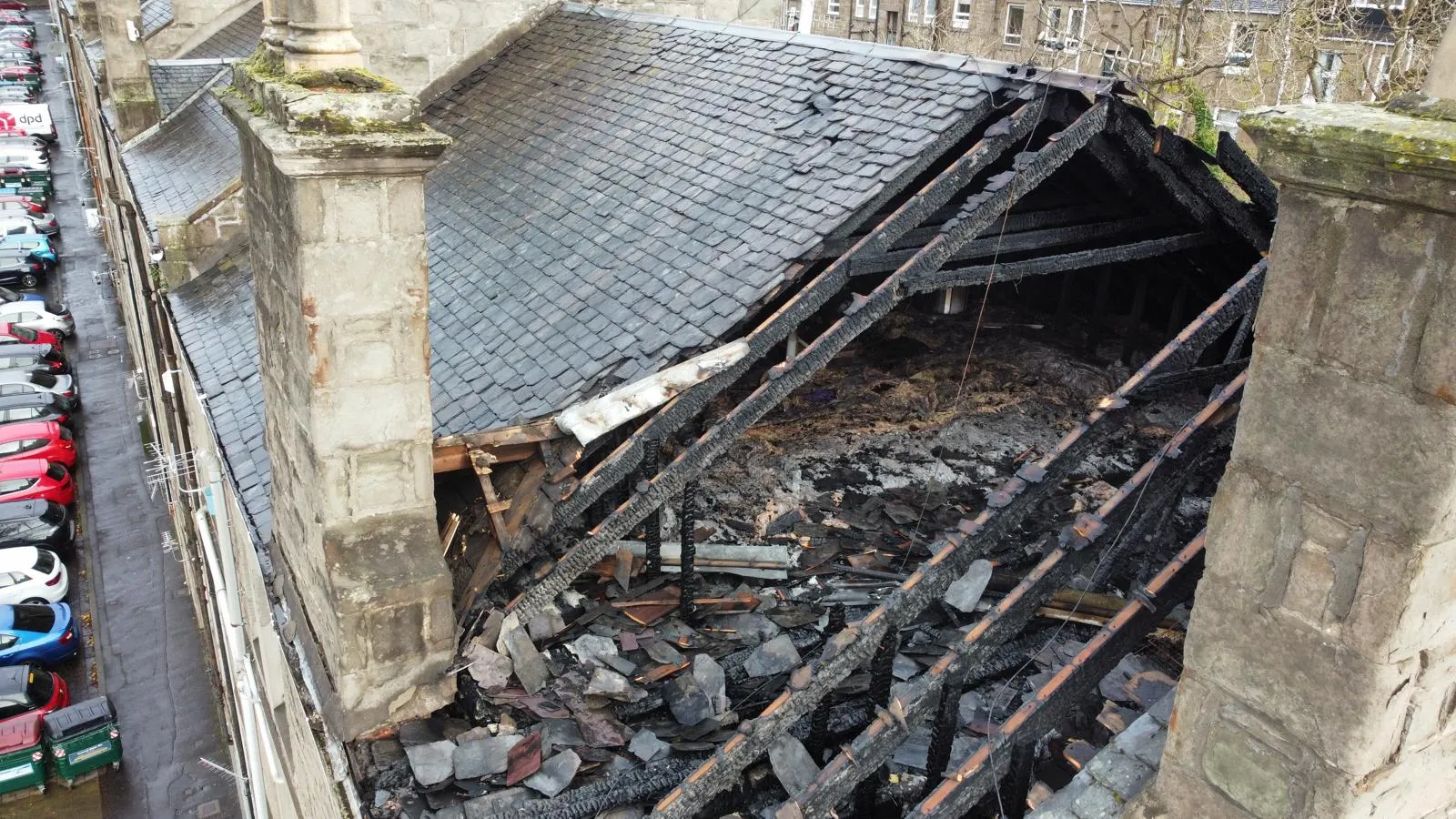 Severe roof damage to a Dundee building, seen from a drone